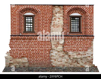 Ancient ruined wall restored with modern bricks. Isolated on white Stock Photo
