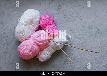 Colorful tangles of yarn, wool cotton yarns with needle for knitting Stock Photo