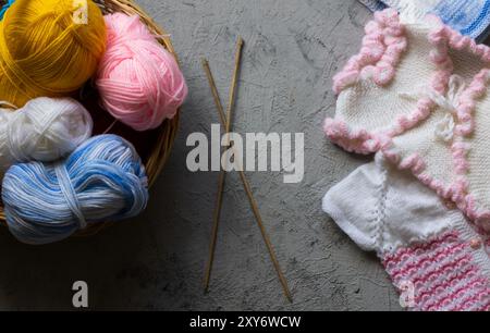 Colorful tangles of yarn, wool cotton yarns with needle for knitting Stock Photo