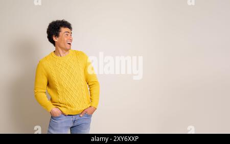 Handsome professional with hands in pockets looking at copy space with surprised on white background Stock Photo