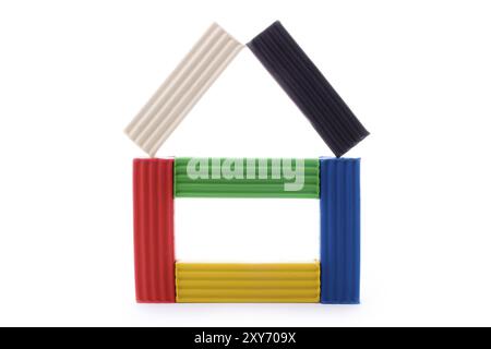 Close up shot of plasticine house isolated on white Stock Photo