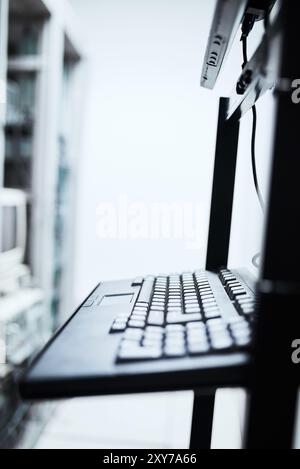 Keyboard, empty server room or IT computer for networking, cybersecurity or cloud computing. Data center, keypad or closeup of technology for machine Stock Photo