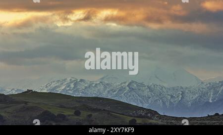 Snow-capped mountains under a dramatic sky at sunset, Lefka Ori, White Mountains, mountain massif, west, Crete, Greece, Europe Stock Photo
