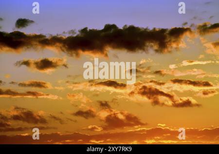 Heavenly landscape with dramatic crimson sunset clouds Stock Photo