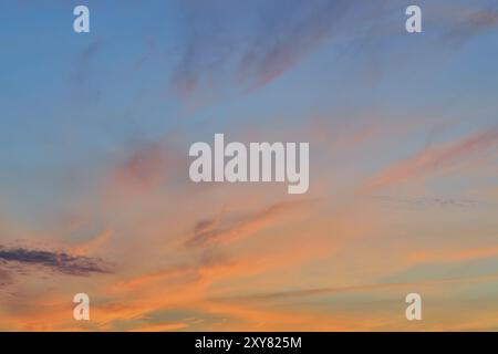 Heavenly landscape with dramatic crimson sunset clouds Stock Photo