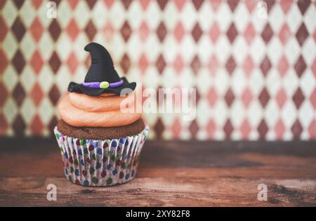 Halloween design homemade cupcake on dark background Stock Photo