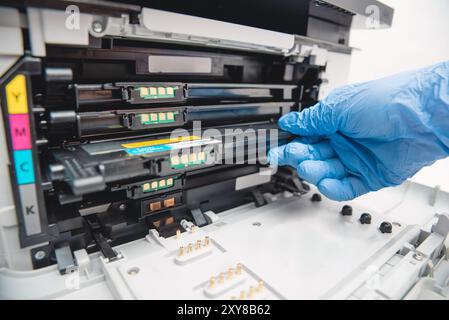 Man replacing cartridge in printer at office. Laser printer supplies Stock Photo