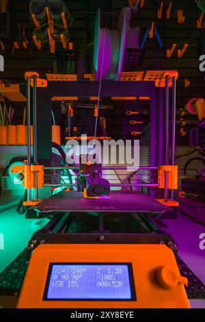Wide shot 3D printer. Design studio. Home production prototyping. Tools wall. Stock Photo