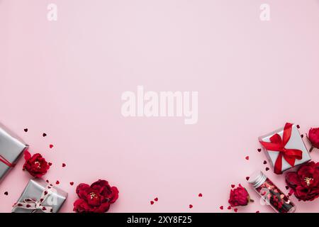 Saint Valentine, Mothers day card template, greeting, wedding invitation flat lay. Top view on pink background with gray paper gift boxes with red rib Stock Photo