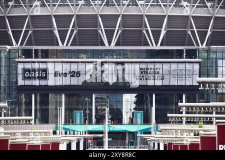 London, England, UK. 28th Aug, 2024. Screens at Wembley Stadium advertise the forthcoming gigs by Oasis, currently scheduled to play four nights in July and August 2025 at the famous stadium, as tickets are due to go on sale later in the week. The Manchester rock band, led by Noel and Liam Gallagher, recently announced a reunion tour after 15 years. (Credit Image: © Vuk Valcic/ZUMA Press Wire) EDITORIAL USAGE ONLY! Not for Commercial USAGE! Stock Photo