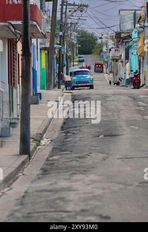 646 Front view, old light-blue American classic car -Chevrolet 1952- stopped next to the curbside, sloping street in Regla municipality. Havana-Cuba. Stock Photo