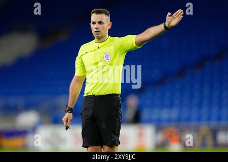 Referee Tom Nield during the Carabao Cup second round match at the Cardiff City Stadium. Picture date: Wednesday August 28, 2024. Stock Photo