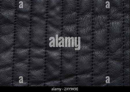 Black soft leather texture with stitches macro close up view Stock Photo