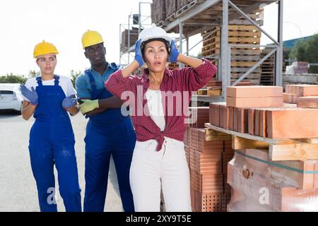 Workers have problems at work at a hardware store Stock Photo