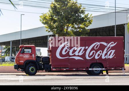 Marilia, Sao Paulo, Brazil, April 23, 2024. Delivery truck from the distribution company Coca-Cola Femsa, parked in front of a supermarket in the city Stock Photo