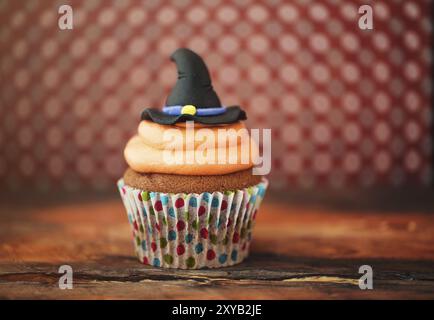 Halloween design homemade cupcake on dark background Stock Photo