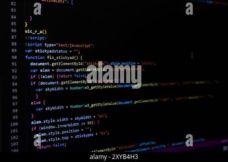 Software source code. Programming code. Programming code on computer screen. Developer working on program codes in office. Source code Stock Photo