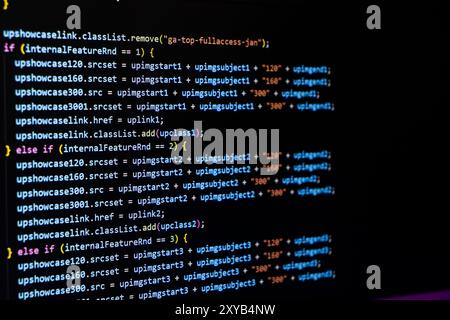 Software source code. Programming code. Programming code on computer screen. Developer working on program codes in office. Source code Stock Photo