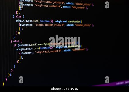 Software source code. Programming code. Programming code on computer screen. Developer working on program codes in office. Source code Stock Photo