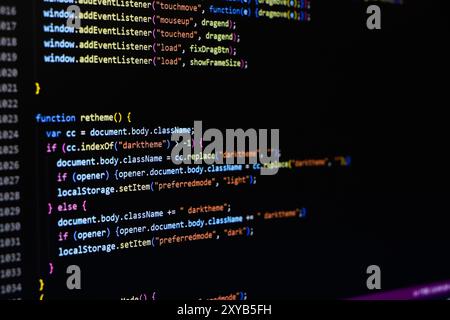 Software source code. Programming code. Programming code on computer screen. Developer working on program codes in office. Source code Stock Photo