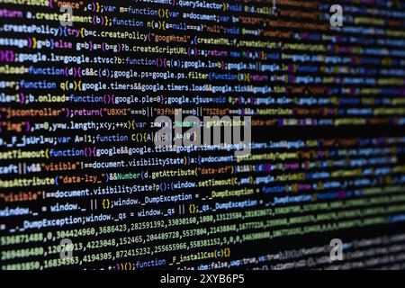 Software source code. Programming code. Programming code on computer screen. Developer working on program codes in office. Source code Stock Photo