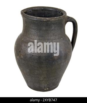 Clay pot of manual work. It is possible to store milk or other liquid Stock Photo