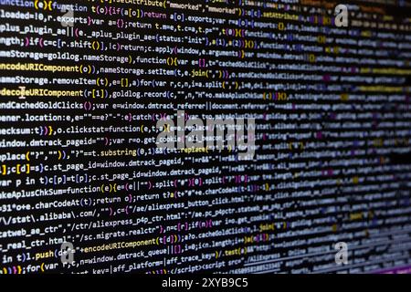 Software source code. Programming code. Programming code on computer screen. Developer working on program codes in office. Source code Stock Photo