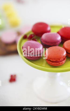 French homemade macaroons. Strawberry, pistachio, vanilla and raspberry macaroons Stock Photo
