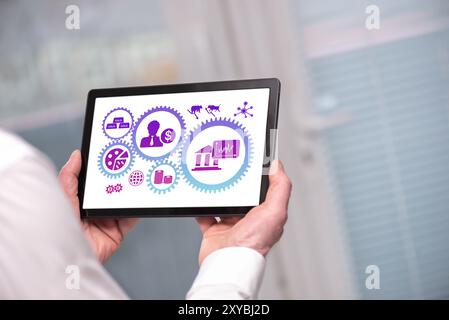 Stock market concept shown on a tablet held by a man Stock Photo
