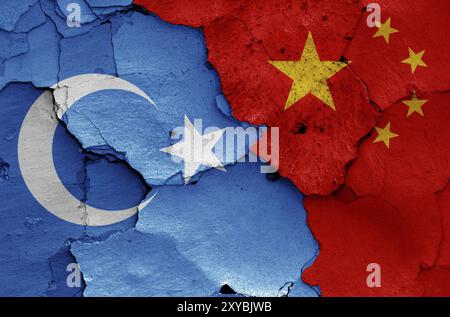 Flags of East Turkestan and China painted on cracked wall Stock Photo