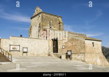 Primitiva iglesia parroquial de Nuestra Senora de la Encarnacion, sigloXVII, Castillo de Alora, siglo X, Cerro de Las Torres. monumento nacional, Alor Stock Photo