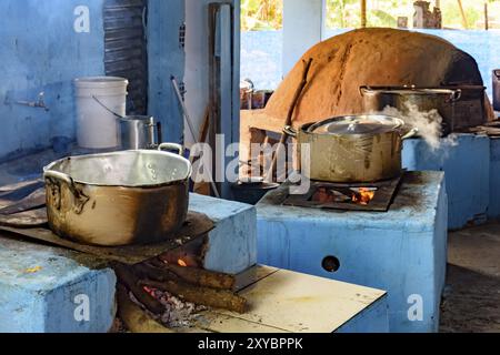 Farm rustic kitchen in the interior of Brazil with wood stove and oven of clay preparing the food to be served Stock Photo