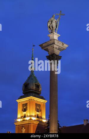 King Sigismund III Vasa column and clocktower of the Royal Castle at night, city of Warsaw, Poland, Europe Stock Photo