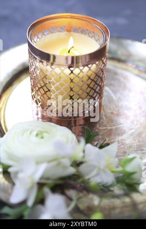 Festive invitation card with beautiful flowers and tray with burning candle on the dark background Stock Photo