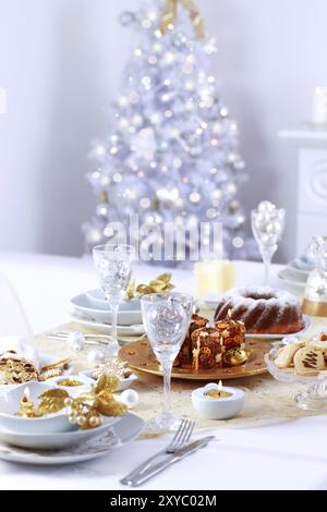 Place setting for Christmas with Christmas tree Stock Photo