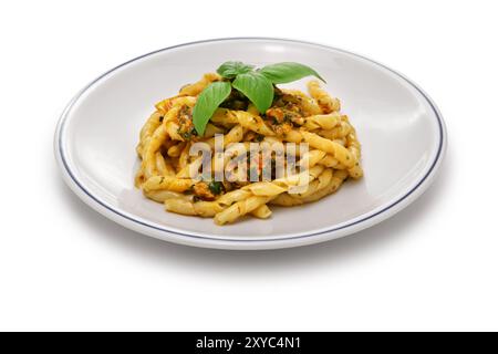 Busiate alla Trapanese is made from a specialty pasta from the province of Trapani called Busiate, then boiling it and tossing it in a Trapanese sauce Stock Photo