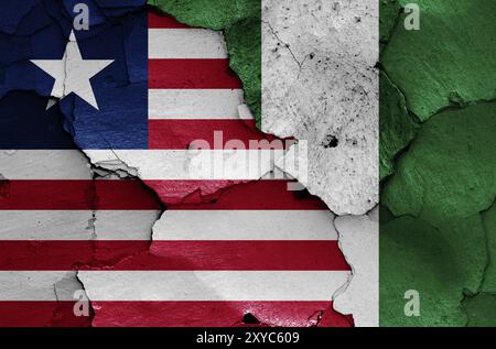 Flags of Liberia and Nigeria painted on cracked wall Stock Photo