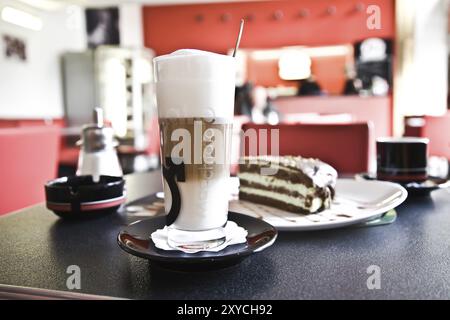 Breakfast In One Of City Cafe. Cups Of Coffee And Cake Stock Photo