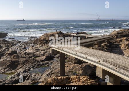 Passadico das Ondas boardwalk, rocks and surf on the beach promenade in Nevogilde, Norte region, Porto district, Portugal, Europe Stock Photo