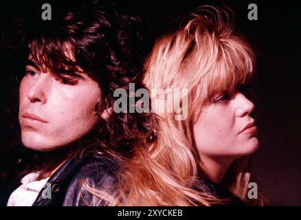 Close-up head & shoulders of young man & woman couple. Stock Photo