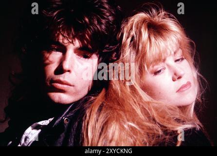 Close-up head & shoulders of young man & woman couple. Stock Photo