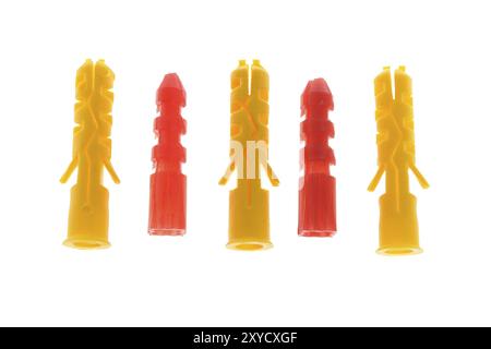 Five Colorful Plastic Dowels on White Background Stock Photo