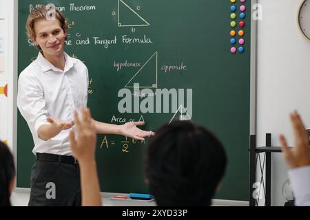 Explaining Mathematics Concepts in Classroom Setting Stock Photo