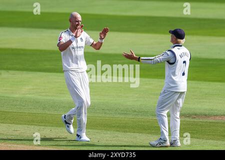 Taken in Birmingham, UK on 29 Aug 2024 at Warwickshire County Cricket Club, Edgbaston.  Pictured is #20, Olly Hannon-Dalby of Warwickshire being congratulated by #2, Jacob Bethell of Warwickshire for his dismissal of #34, Jack Leaning of Kent caught by #16, Sam Hain of Warwickshire during the 2024 County Championship match between Warwickshire CCC & Kent CCC  Image is for editorial use only - credit to Stu Leggett via Alamy Live News Stock Photo