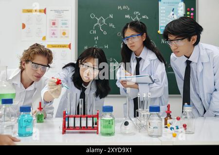 Conducting Science Experiment in Laboratory with Students Stock Photo