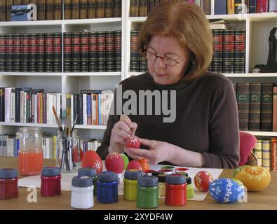 Colouring Easter eggs Stock Photo