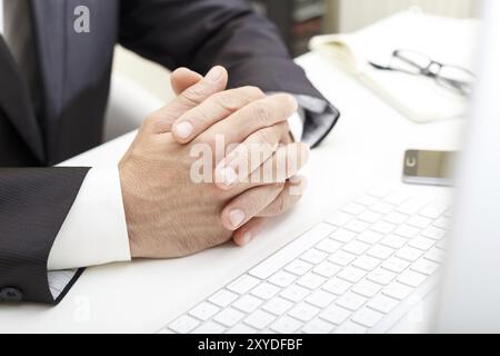 Businessman at the meeting, modern desk, computer, notepad business concept close up Stock Photo