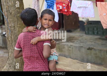 Brothers at a temporary relief camp at Pratapgarh English Medium School in Agartala. These people were affected for heavy flooding in Tripura, India. Stock Photo