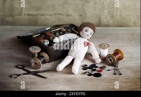 Simple old rag doll with attached red heart Stock Photo - Alamy