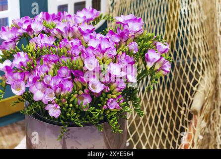 Flower bouquet of pink and white (alstroemeria) holiday panoramic background and rope net Stock Photo